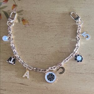 Gold Charm Bracelet with Black and white Accents